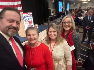 Elena Quinn, Danielle Ahrens, and Donna Thomas with Sebastian Gorka at the Kootenai County Lincoln Day Dinner